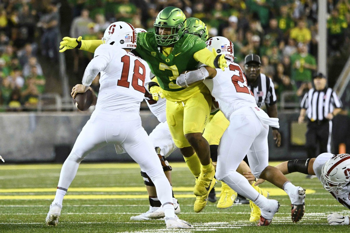 Oct 1, 2022; Eugene, Oregon, USA; Oregon Ducks defensive end Brandon Dorlus (3) sacks Stanford Cardinal quarterback Tanner McKee (18) during the second half at Autzen Stadium. The Ducks won the game 45-27. Mandatory Credit: Troy Wayrynen-USA TODAY Sports  